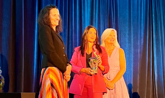 Dr. Ashley N. Amalfi winning an award